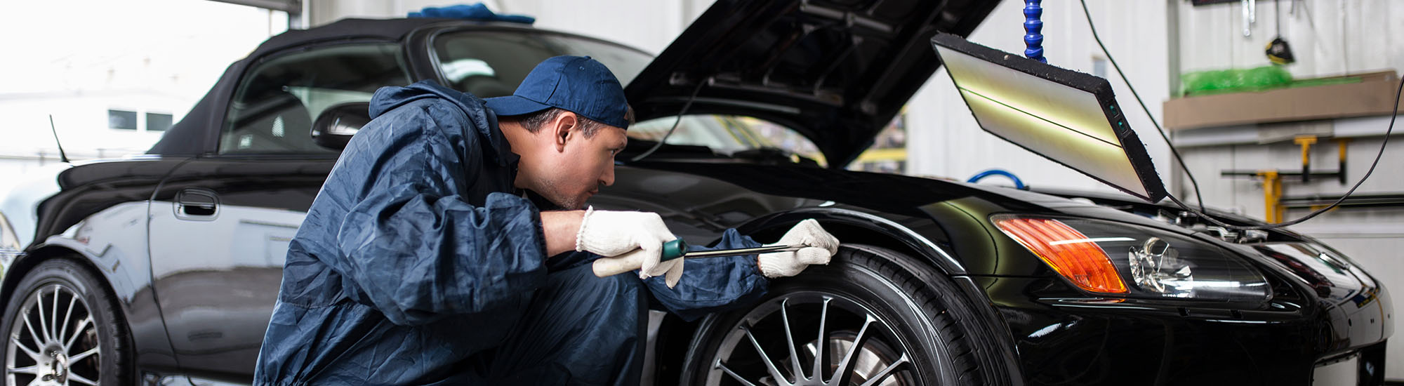 A Mechanic Working At Garage